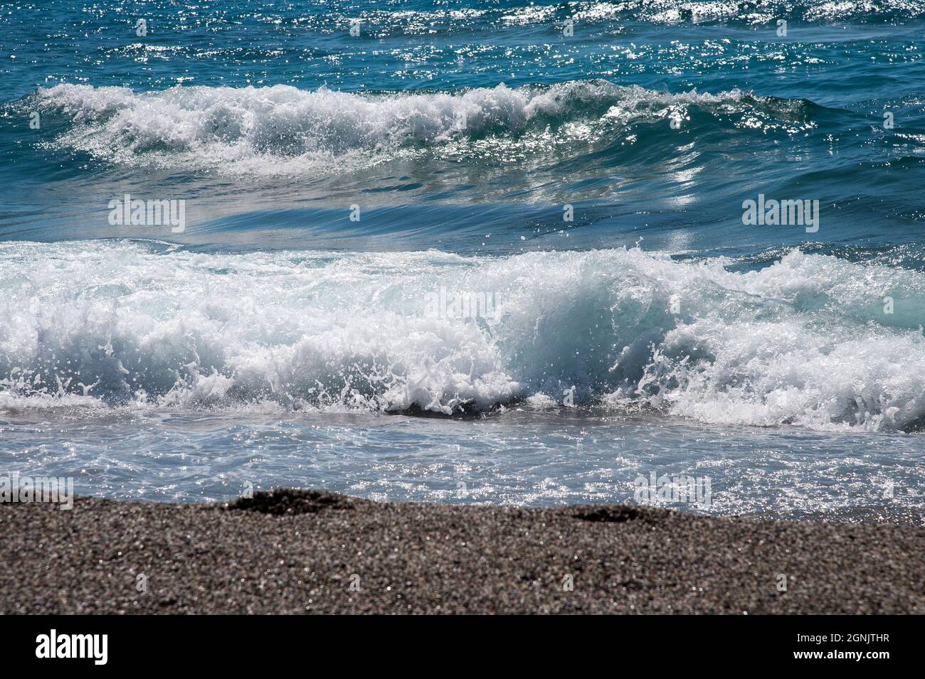 Waves splashing beach hi-res stock photography and images - Alamy
