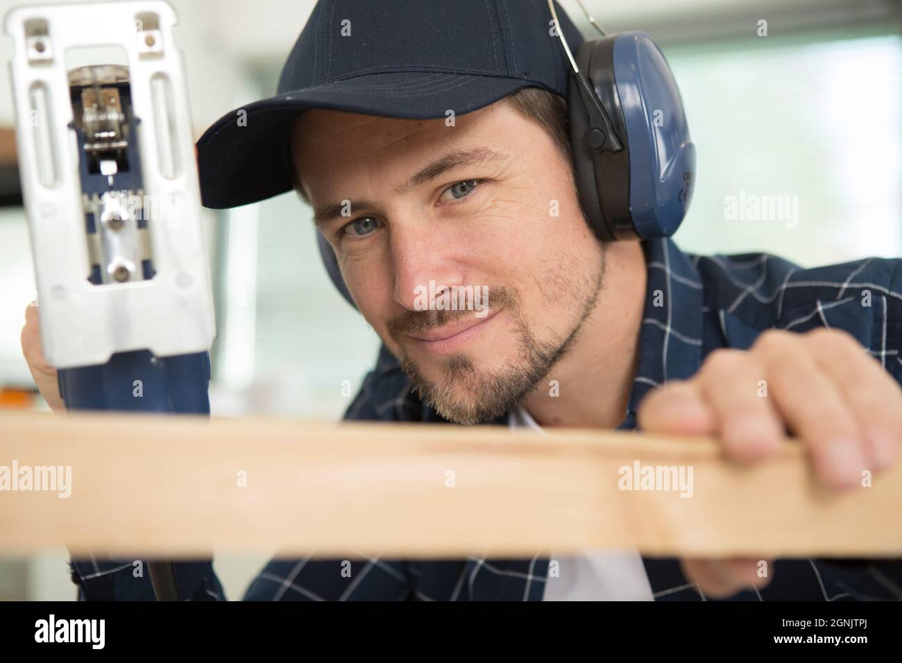 Man cuts wood products hi-res stock photography and images - Alamy