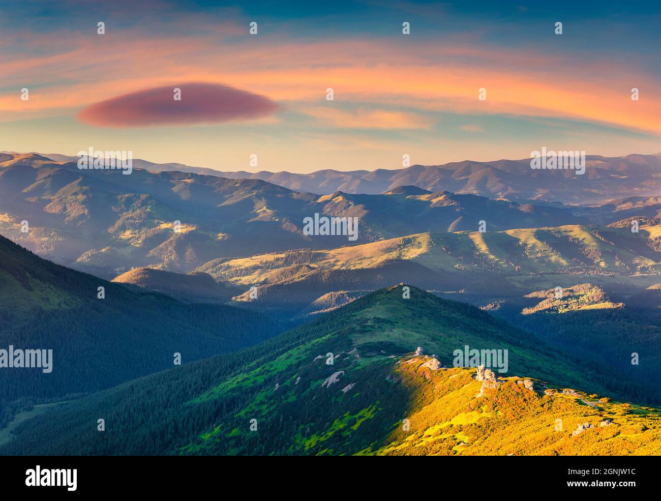 Adorable sunrise in Carpathian mountains. Picturesque summer view of mountain ranges and valleys, Dzembronya village location, Ukraine, Europe. Beauty Stock Photo