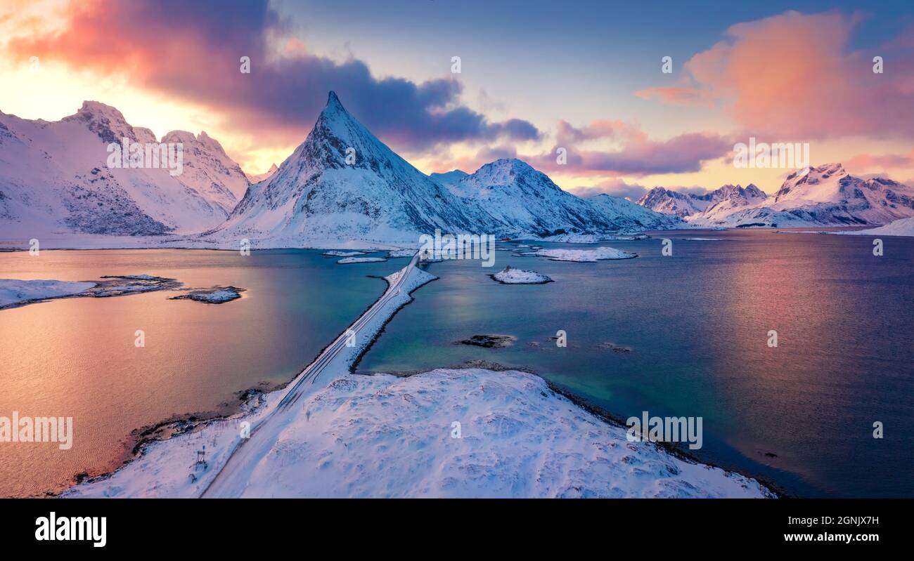 Amazing view from flying drone of Lofoten Islands. Colorful winter sunrise  on Norway, Europe. Aerial morning view of Fredvang bridge with Volandstind  Stock Photo - Alamy