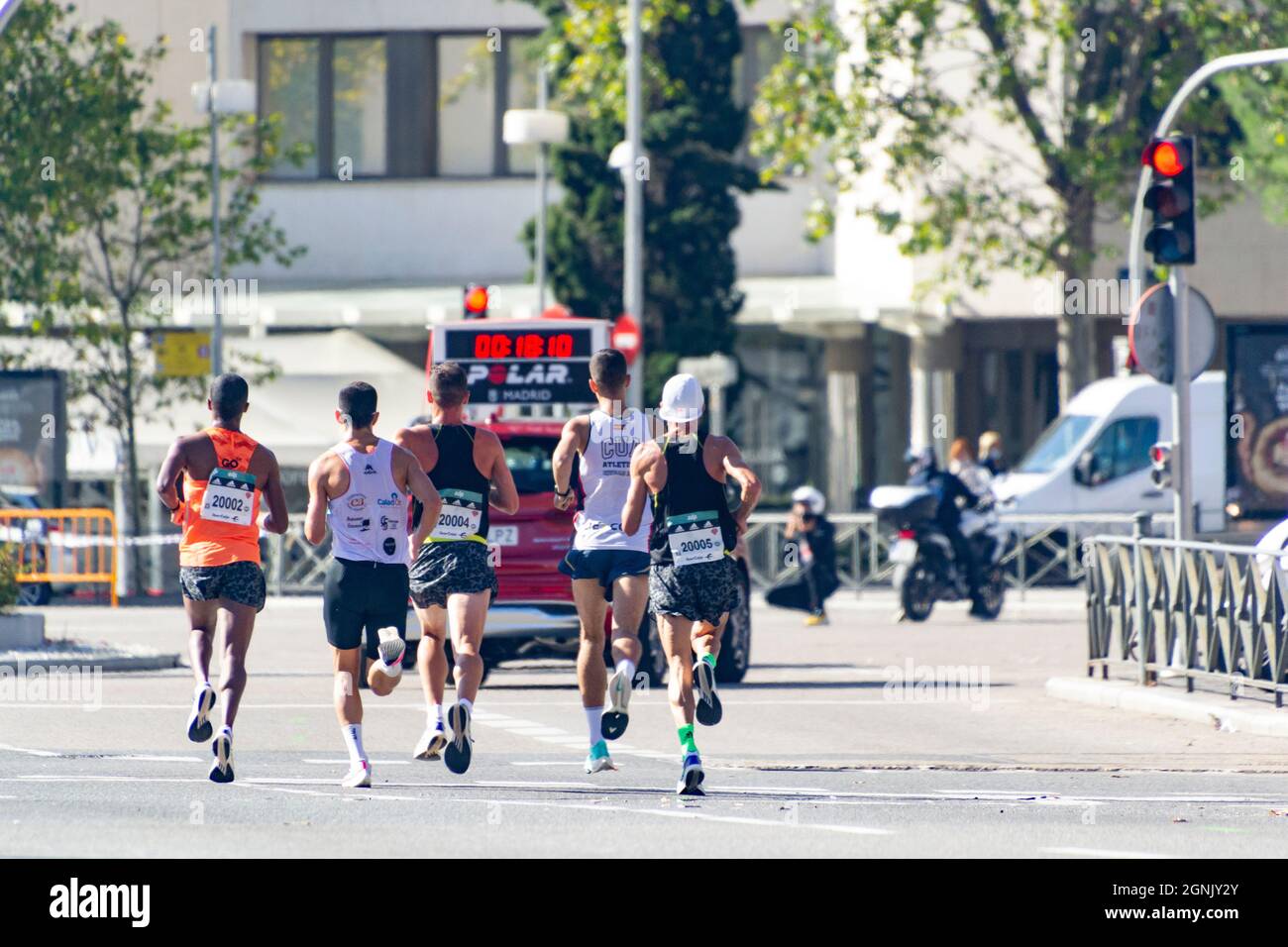 Group of professional athletes walking the streets of Madrid doing the Madrid Half Marathon. Chema Martinez. In Spain. Europe. Horizontal photography. Stock Photo