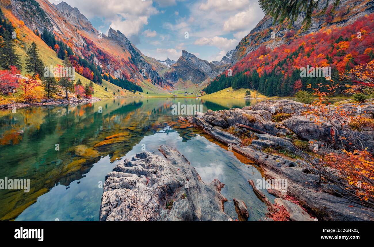 Landscape photography. Attractive morning view of Swiss Alps. Santis peak reflected in the calm surface of pure water of lake. Spectacular autumn scen Stock Photo