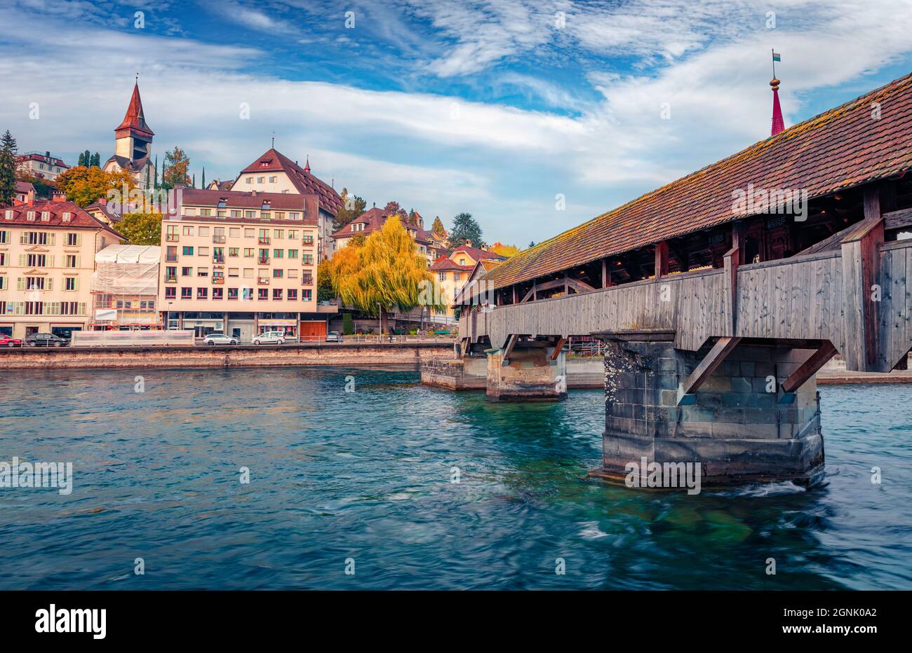 Famous old wooden Spreuer Bridge, 15th-century, covered pedestrian bridge featuring a series of paintings with a death motif. Lucerne cityscape, Switz Stock Photo