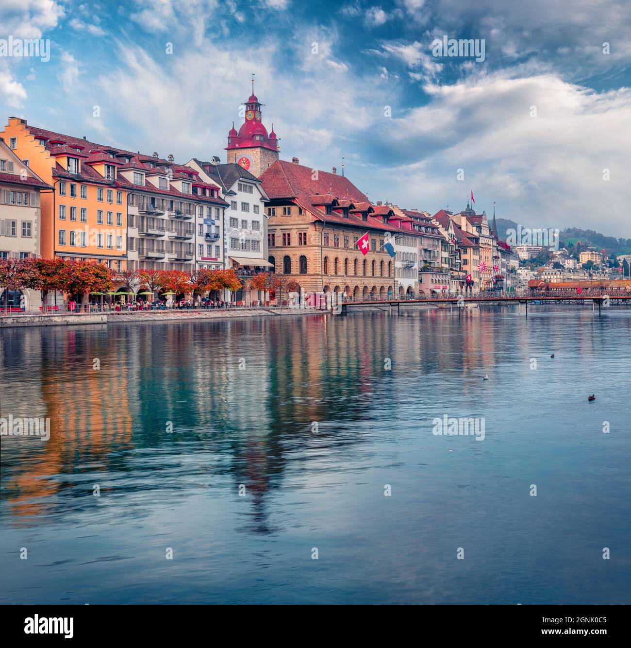 Сharm of the ancient cities of Europe. Beautiful autumn cityscape of Lucerne town with Kornschutte tower on background. Attractive morning view of Reu Stock Photo