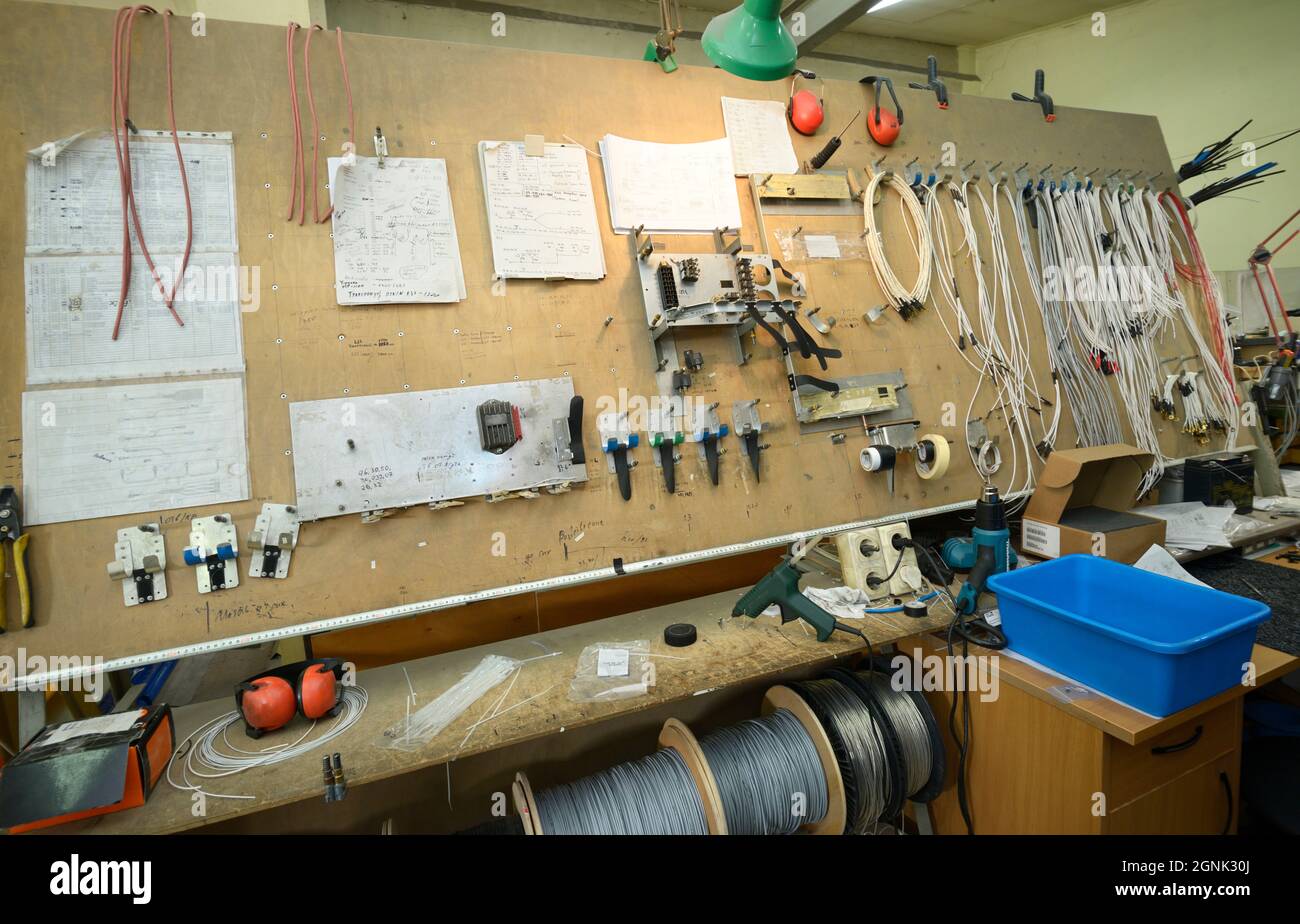 Stand with tools, gears, instruments and wires at the electrician shop