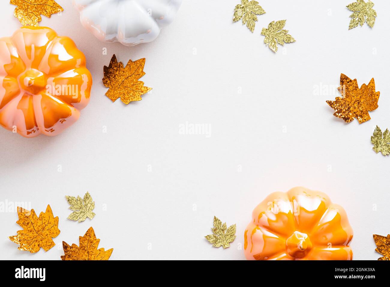 Autumn composition. Frame made of orange pumpkins and maple leaves ...
