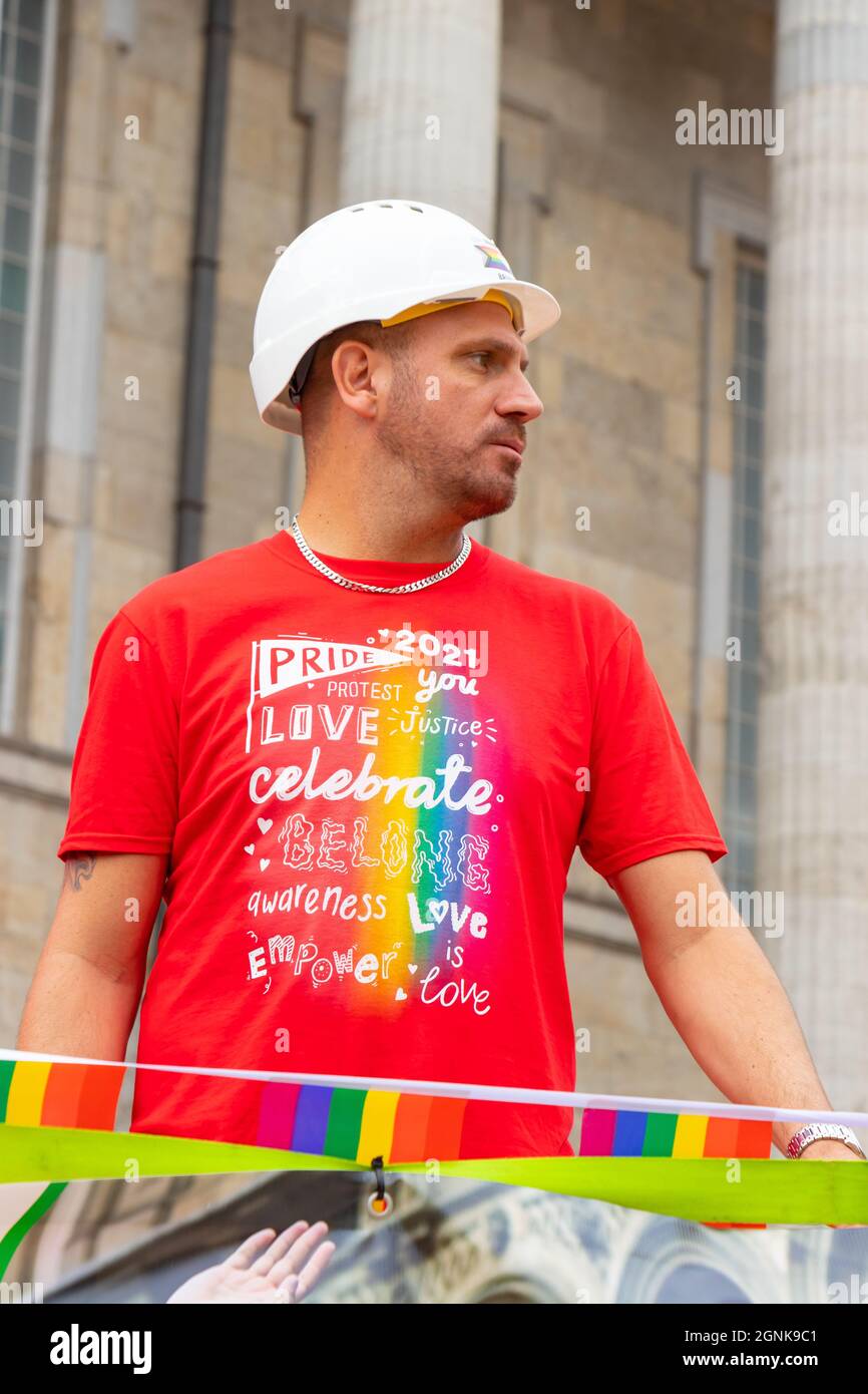 Pride parade construction worker hires stock photography and images