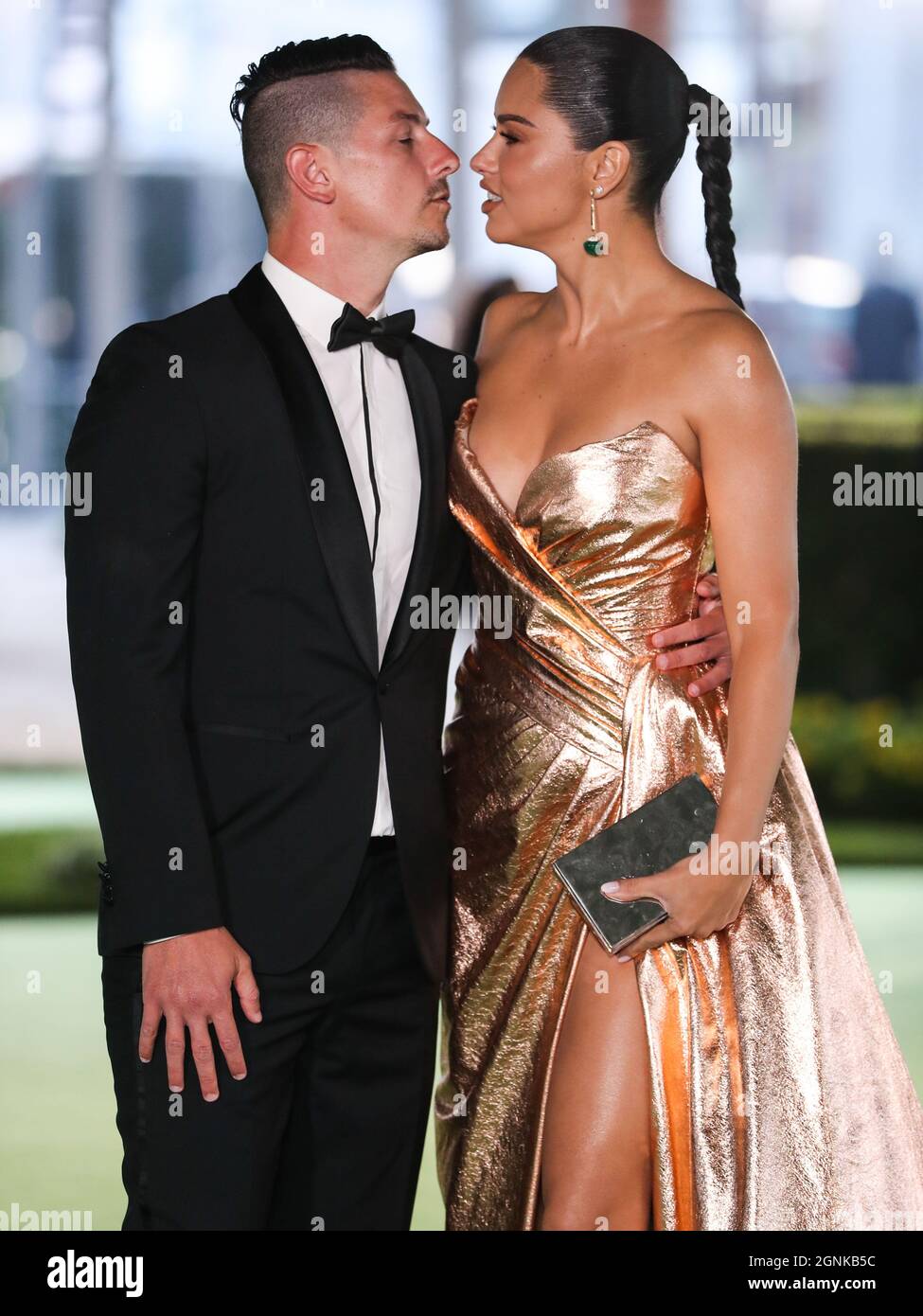 LOS ANGELES, CALIFORNIA, USA - SEPTEMBER 25: Andre L III and  girlfriend/model Adriana Lima wearing a Nicolas Jebran dress arrive at the  Academy Museum of Motion Pictures Opening Gala held at the