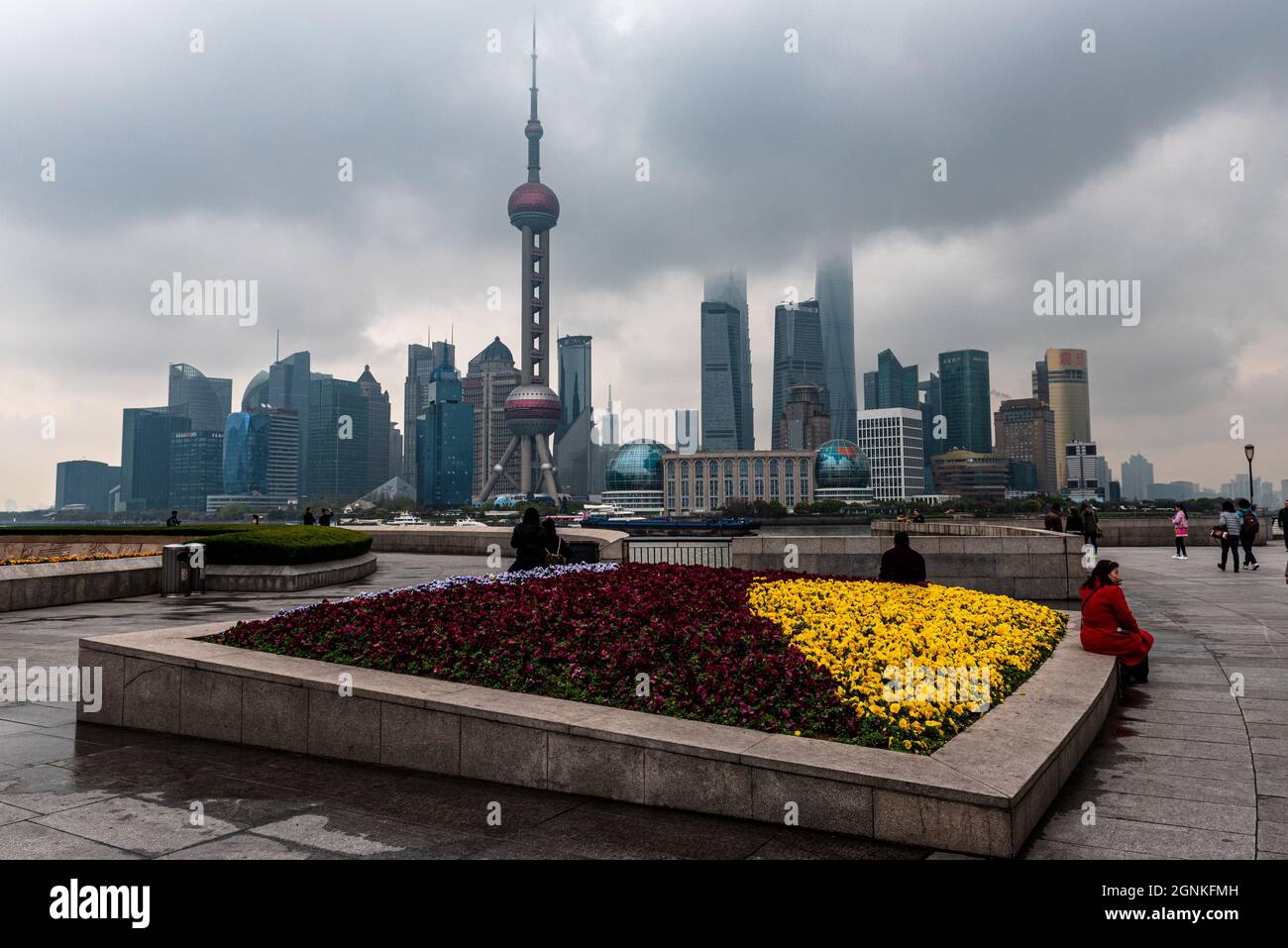 Shanghai, China — March 30, 2016. Photo taken on the Bund on a foggy morning with skyscrapers from Pudong in the frame. Stock Photo