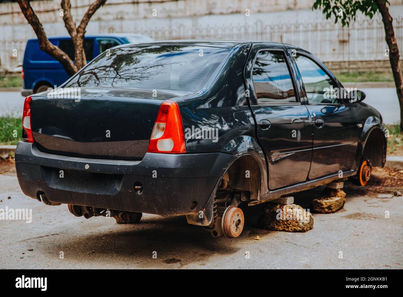 Zaporozhye,Ukraine - July 14 2020 : A broken passenger car without wheels stands on bricks Stock Photo