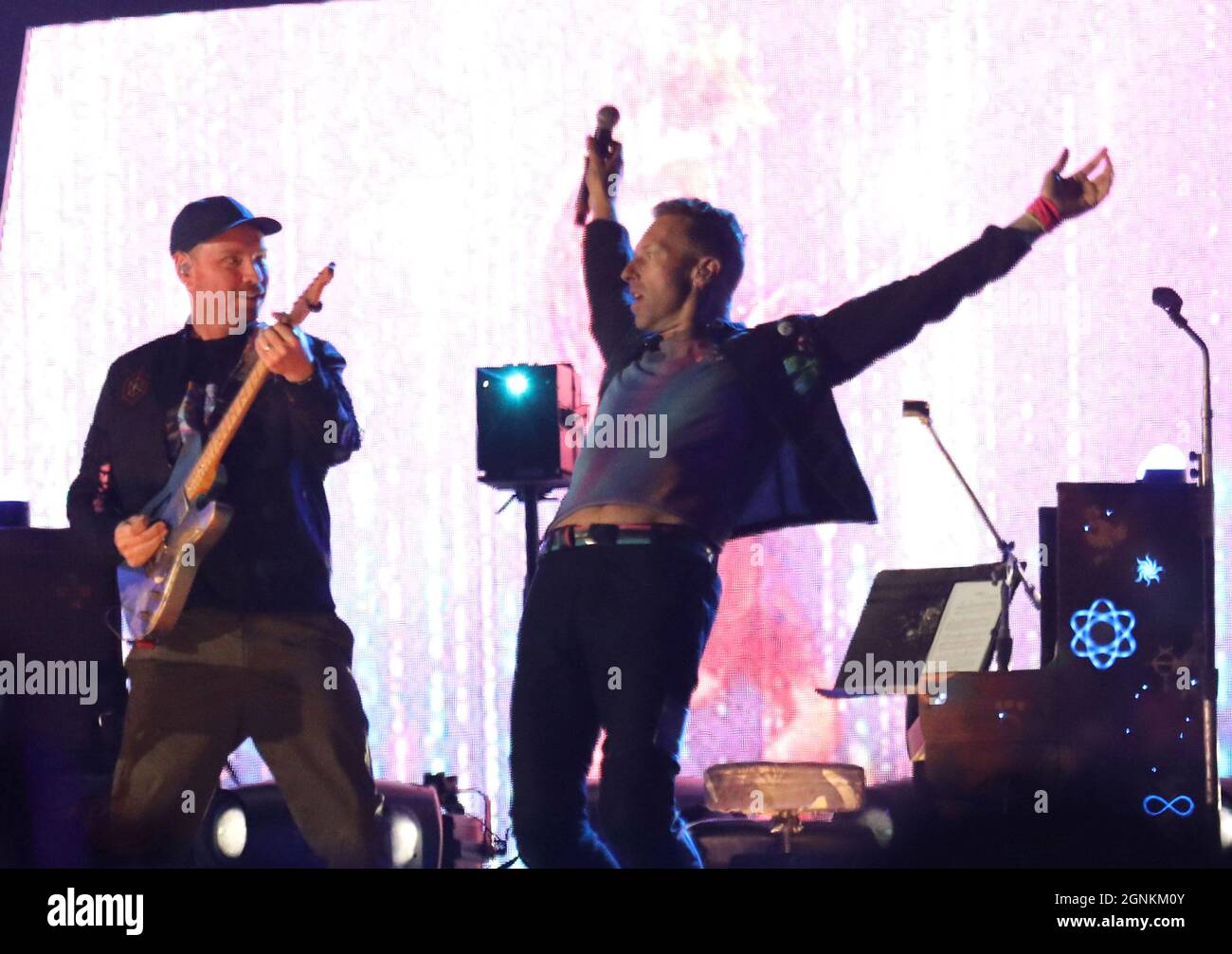 Coldplay band members performing live on stage in the year 2021