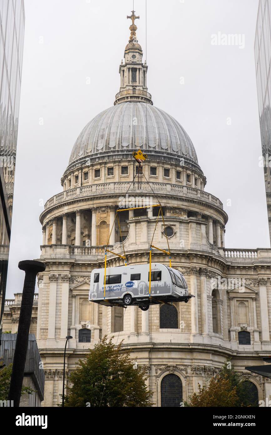 EDITORIAL USE ONLY A caravan manufactured by UK company, Bailey of Bristol is craned onto the rooftop of the One New Change building, London, to celebrate a rise in staycations and caravanning during the COVID pandemic. Picture date: Sunday September 26, 2021. Stock Photo