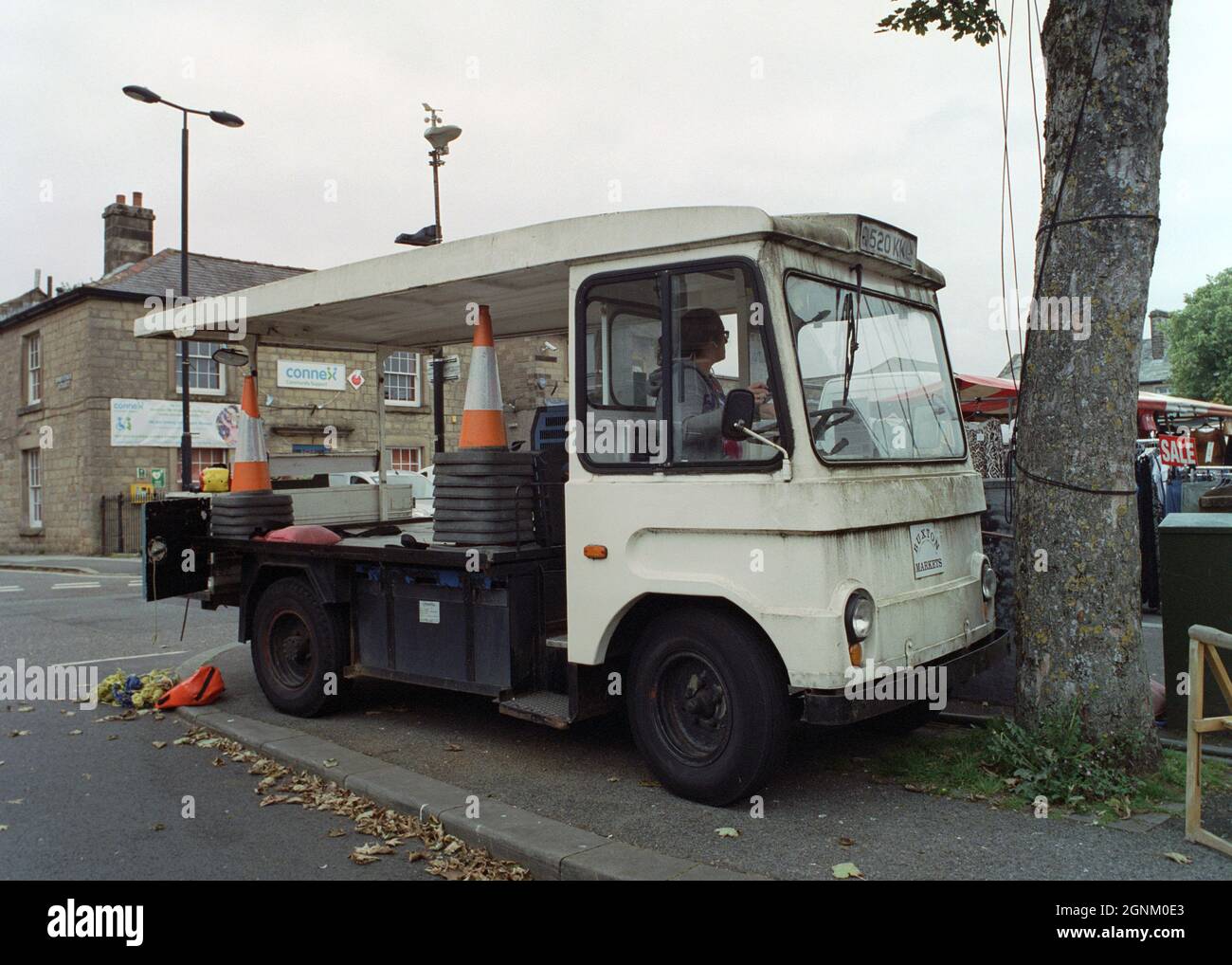 Buxton, UK - 4 September 2021: An old milk float at a market in Buxton. Stock Photo