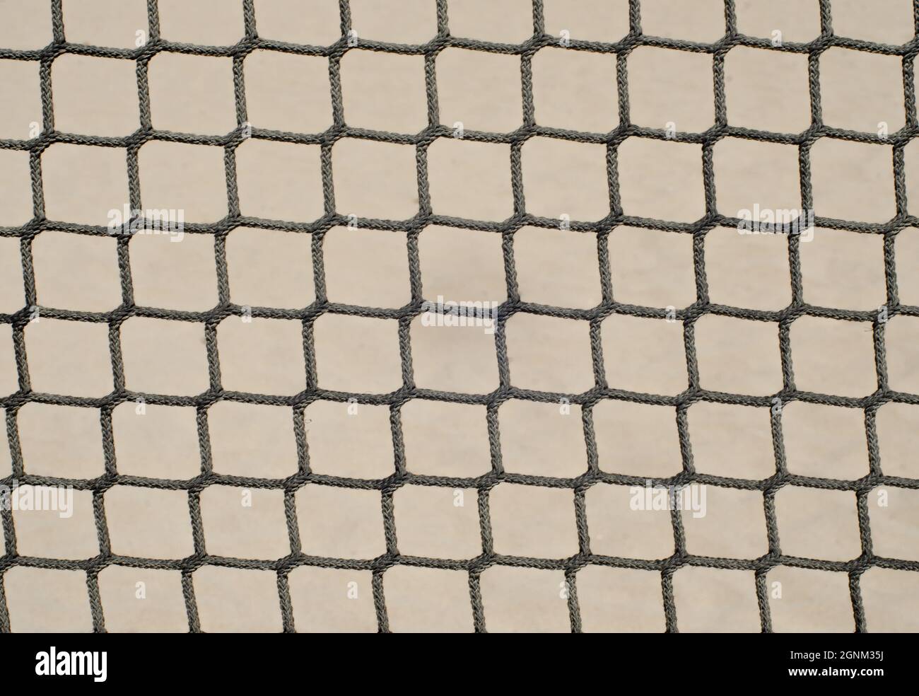 woven rope in the shape of squares. volleyball net. wallpaper concept