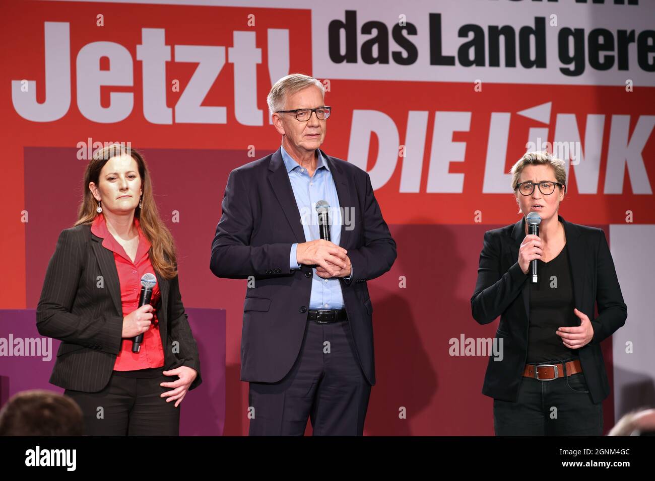 Berlin, Germany. 26th Sep, 2021. Janine Wissler (l-r), party leader of Die Linke, Dietmar Bartsch, parliamentary party leader of Die Linke, and Susanne Hennig-Wellsow, party leader of Die Linke, stand on stage at the election party of Die Linke in the Karl-Liebknecht-Haus after the first forecasts were announced. Credit: Jan Woitas/dpa-Zentralbild/dpa/Alamy Live News Stock Photo