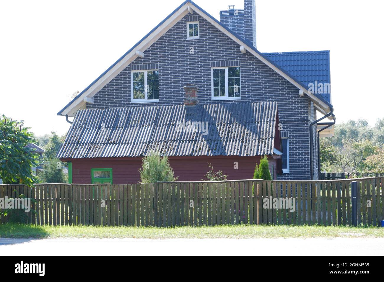 Contrast of old and modern residential building. Stock Photo