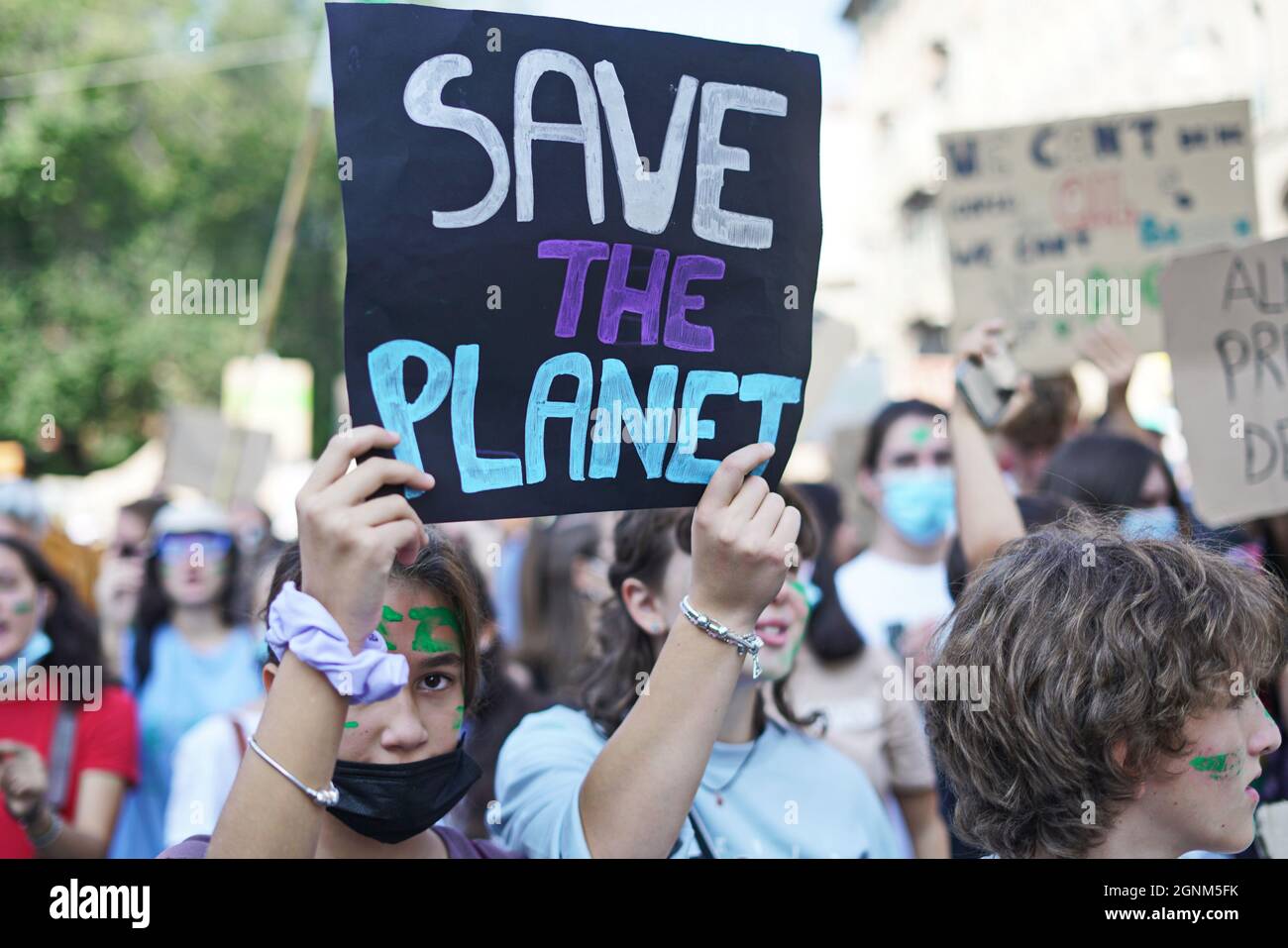 Movement Friday for the Future. Young protesters holding placards during the strike march. Turin, Italy - September 2021 Stock Photo