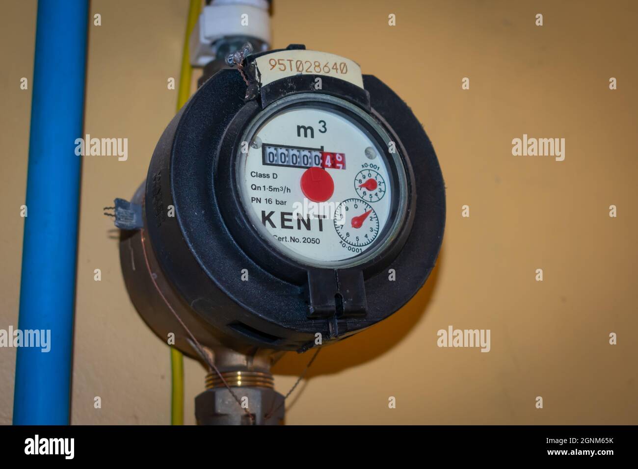 An older style water meter with reading on the amount of water used. Stock Photo