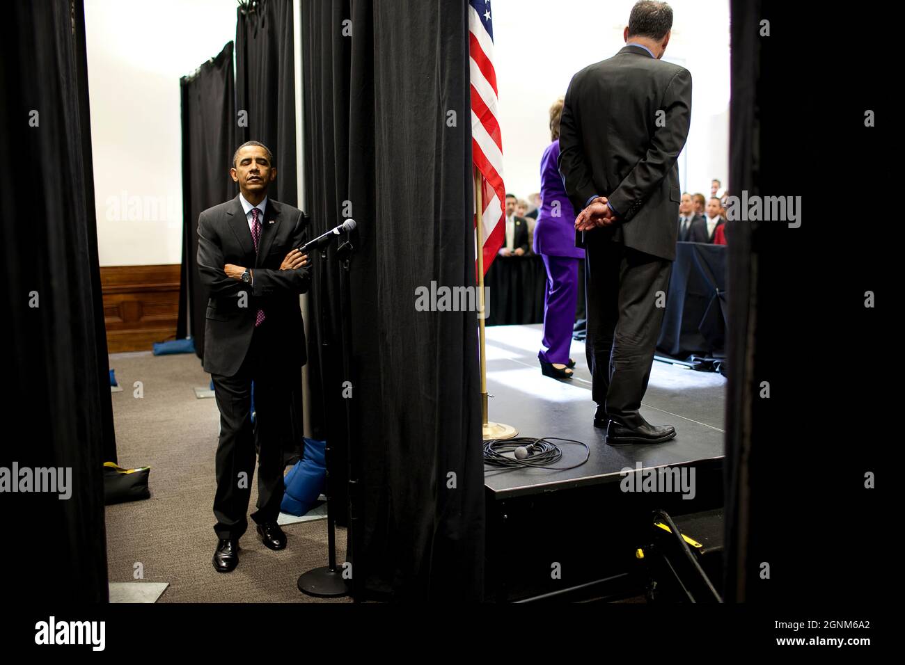President Barack Obama waits backstage as he is introduced during a  reception for Sen. Barbara Boxer, D-Calif., at the California Science Center in Los Angeles, Calif., April 19, 2010. Former Virginia Gov. Tim Kaine, Democratic National Committee (DNC) Chair, and Sen. Boxer are onstage. (Official White House Photo by Pete Souza) This official White House photograph is being made available only for publication by news organizations and/or for personal use printing by the subject(s) of the photograph. The photograph may not be manipulated in any way and may not be used in commercial or politica Stock Photo