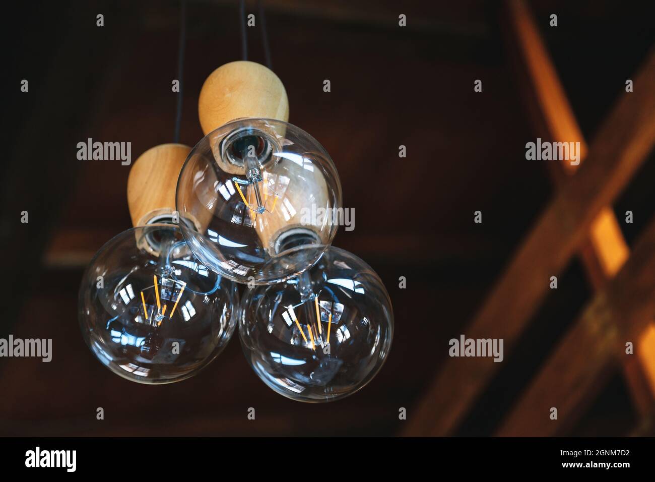 Retro luxury lamps of Edison. Lighting decor in modern wooden house ...