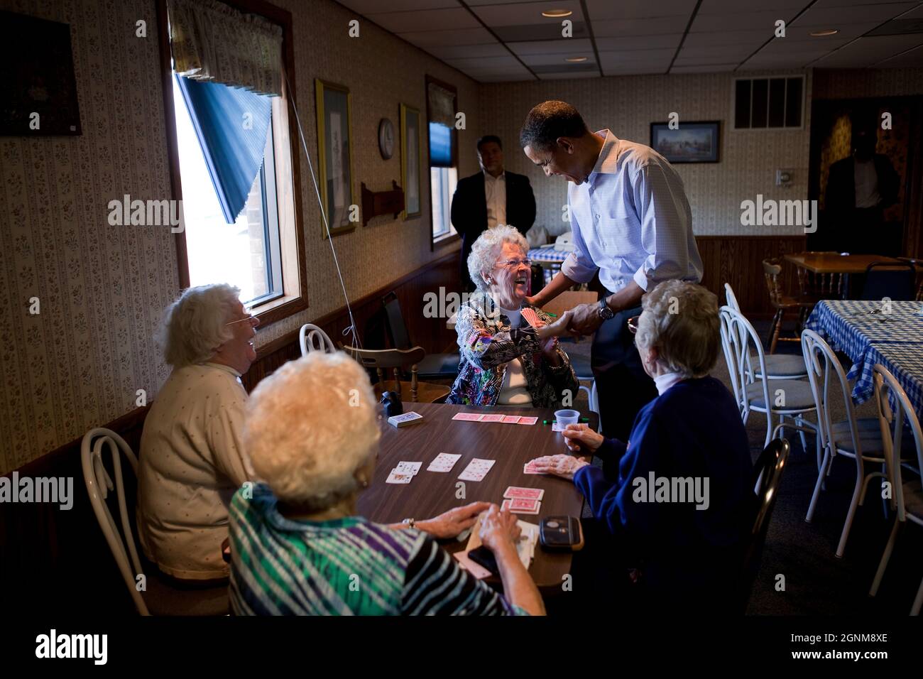 President Barack Obama visits with patrons at Jerry's Family Restaurant in Mount Pleasant, Iowa, April 27, 2010. (Official White House Photo by Pete Souza) This official White House photograph is being made available only for publication by news organizations and/or for personal use printing by the subject(s) of the photograph. The photograph may not be manipulated in any way and may not be used in commercial or political materials, advertisements, emails, products, promotions that in any way suggests approval or endorsement of the President, the First Family, or the White House. Stock Photo