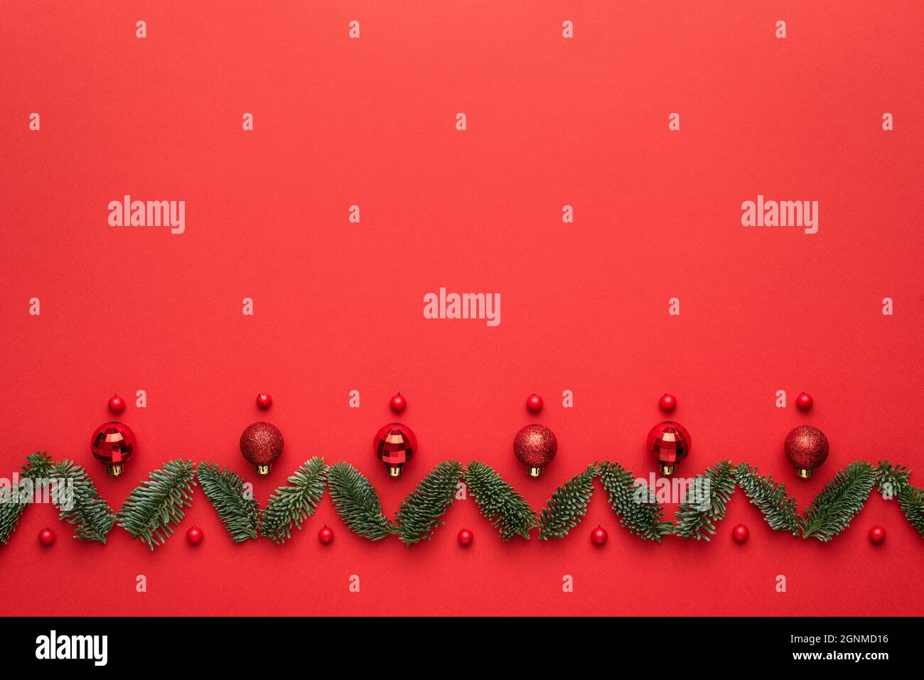 Christmas card with festive ornament on red background, Flat lay, top view and copy space for text Stock Photo