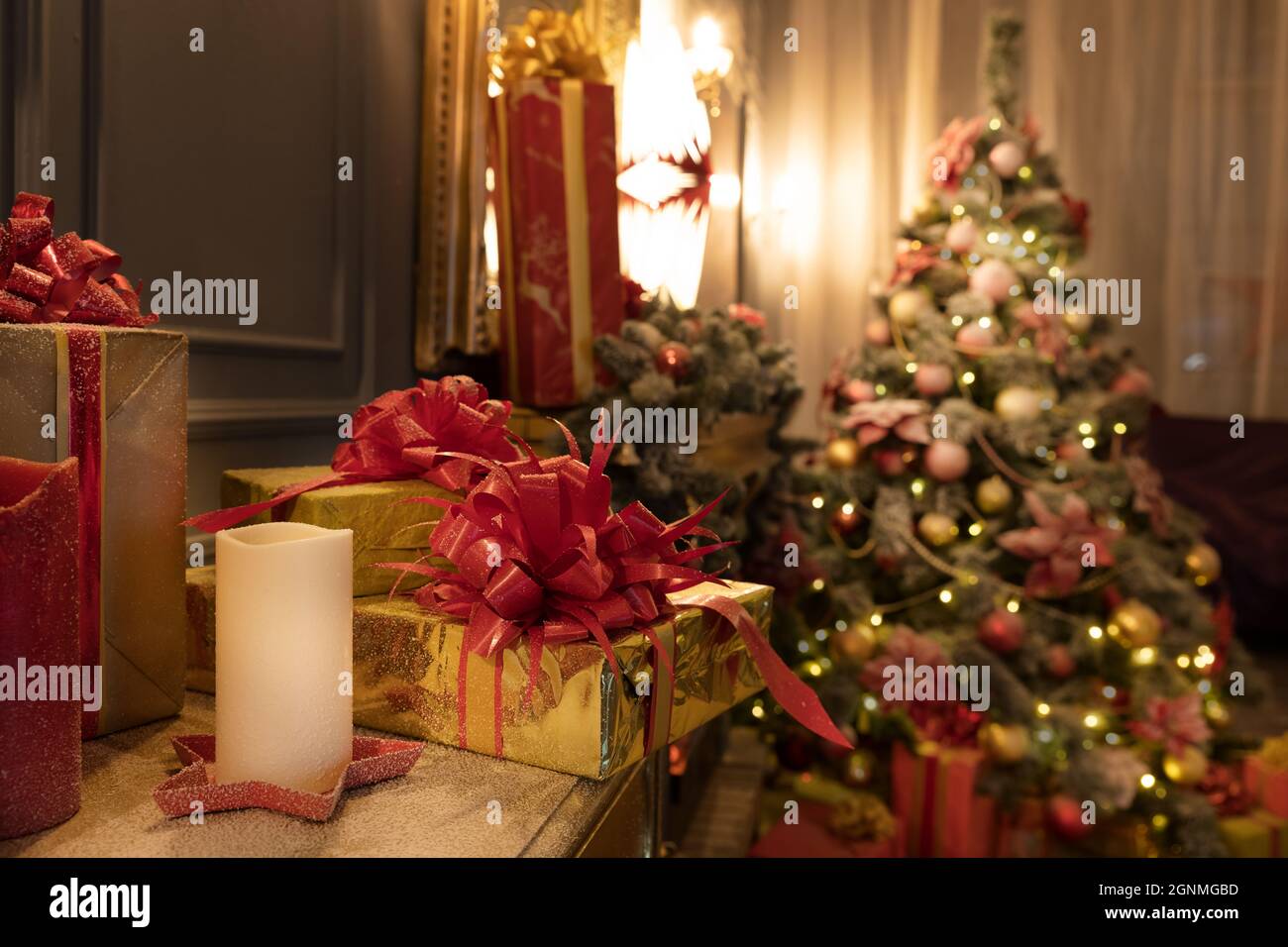Beautiful bright location with a Christmas tree. Room decoration in New Year's style. Stock Photo