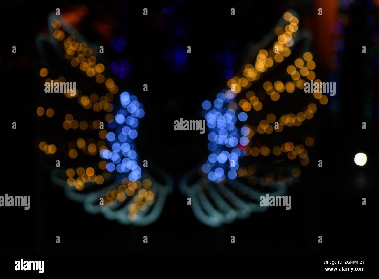 A butterfly formed by LED lights and the Bokeh effect in various colors. Stock Photo