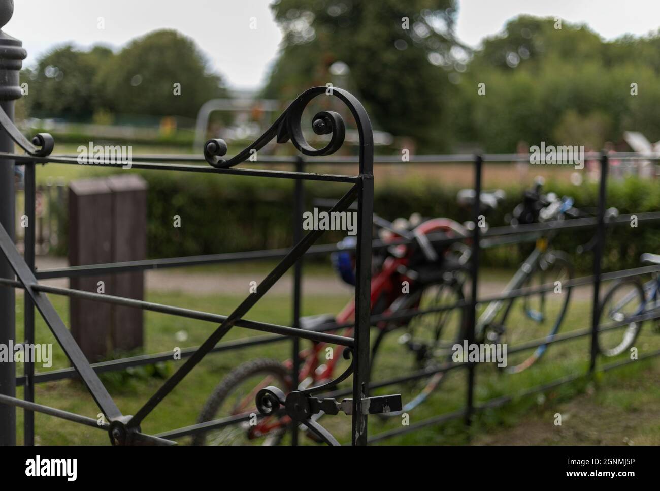 Black wrought iron gate that is open Stock Photo