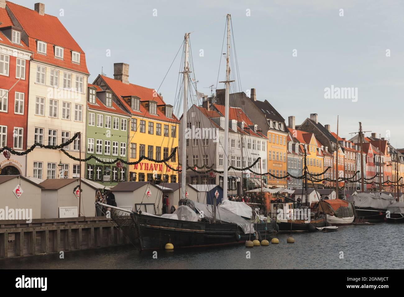 Copenhagen, Denmark - December 9, 2017: Nyhavn view on a sunny day, it is a 17th-century waterfront, canal and popular touristic destination of Copenh Stock Photo