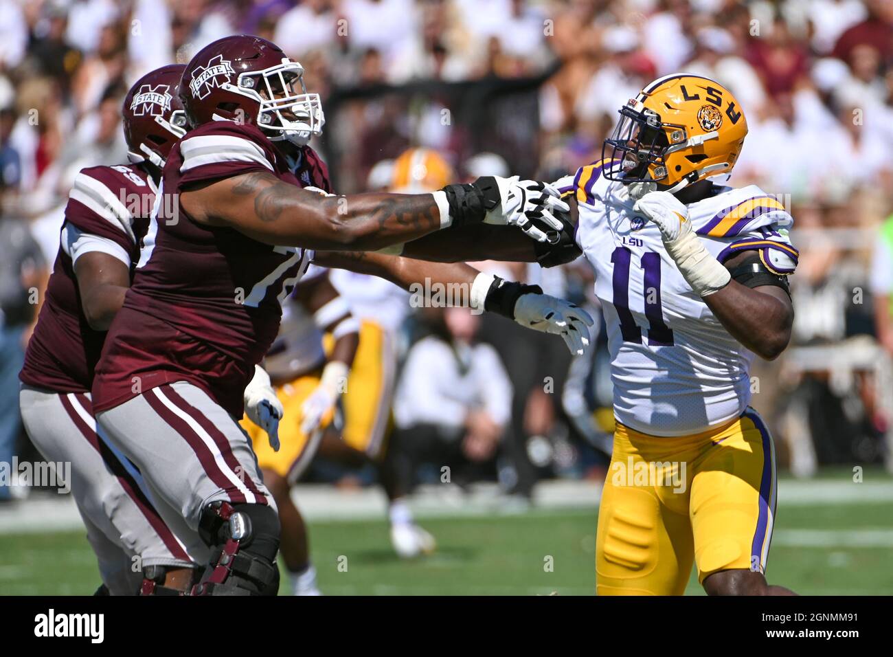 Starkville, MS, USA. 25th Sep, 2021. LSU Tigers defensive end Ali Gaye (11)(right) and Mississippi State Bulldogs offensive lineman Scott Lashley (78)(left) during the NCAA football game between the LSU Tigers and the Mississippi State Bulldogs at Davis Wade Stadium in Starkville, MS. Kevin Langley/CSM/Alamy Live News Stock Photo