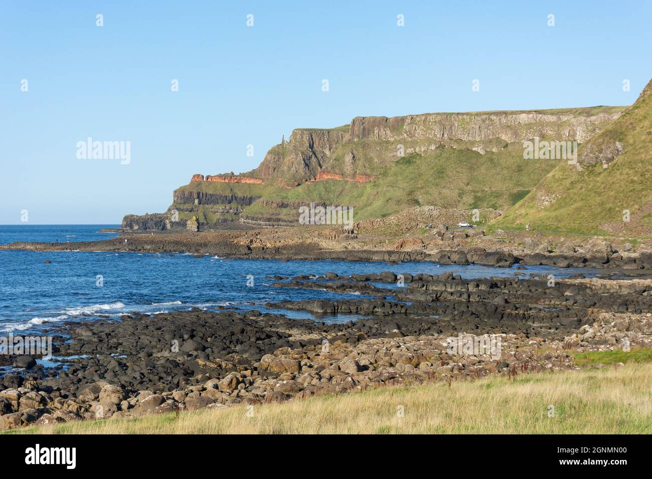 Causeway Coast showing Giant's Causeway, near Bushmills, County Antrim, Northern Ireland, United Kingdom Stock Photo