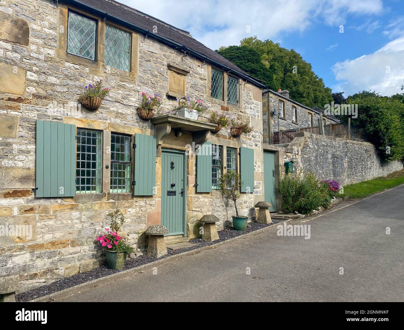 Traditional 18th century cottage in Hartington village in Derbyshire, UK Stock Photo