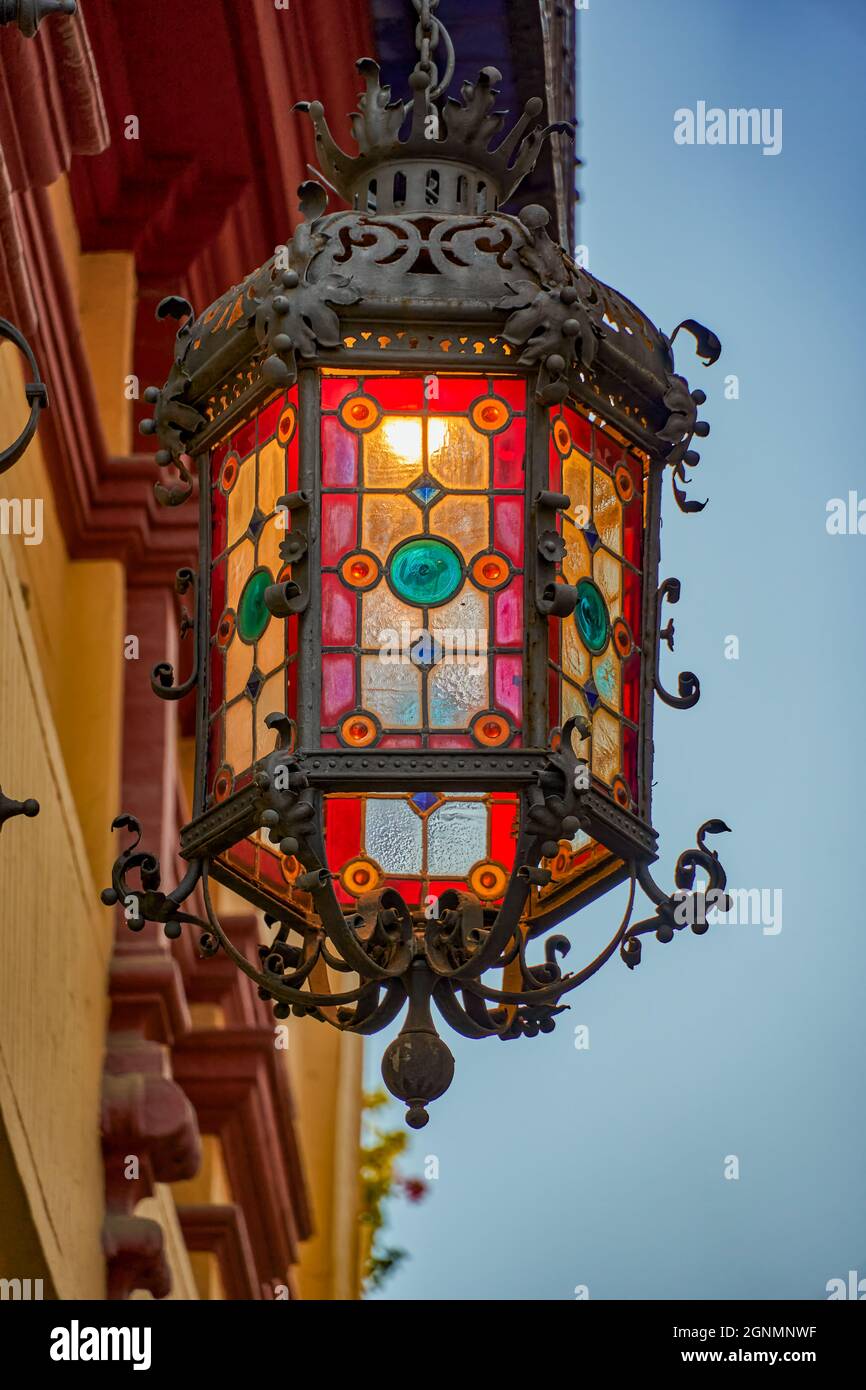 Lantern with a nice and beautiful stained glass window, on a cold Christmas  night. Concept of celebration, festivity Stock Photo - Alamy