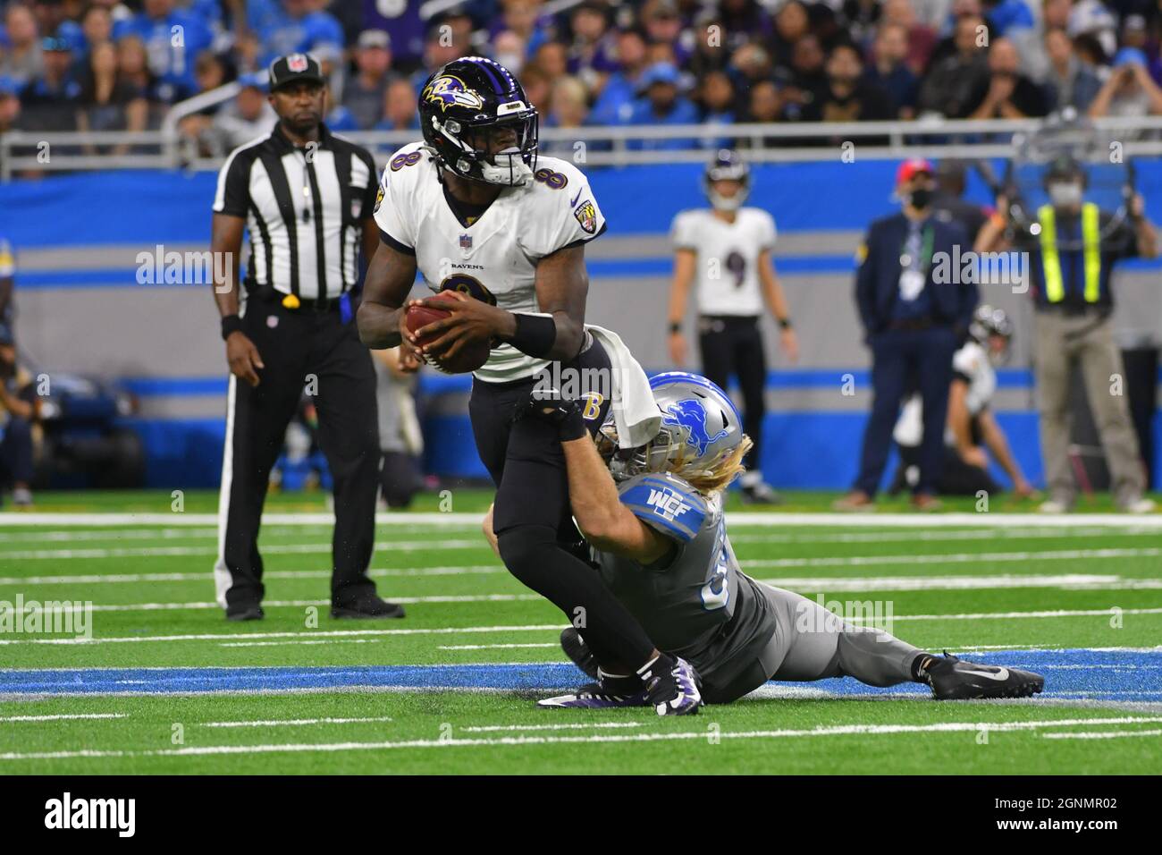 DETROIT, MI - SEPTEMBER 26: Baltimore Ravens quarterback Lamar Jackson (8)  gets sacked by Detroit Lions linebacker Alex Anzalone (34) in the fourth  quarter during NFL game between Baltimore Ravens and Detroit