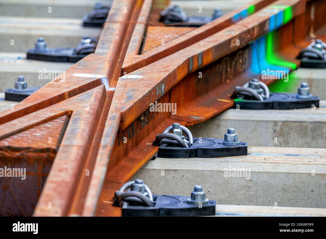 Setting the course: Construction work with laying tram tracks. Stock Photo