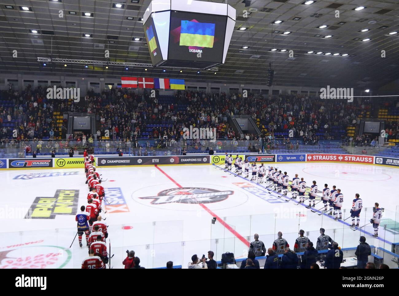 kyiv-ukraine-september-3-2021-players-of-hc-donbass-donetsk-in-red-and-rungsted-seier-capital-listen-to-national-anthems-before-their-champions-hockey-league-game-at-palace-of-sports-in-kyiv-2GNN26P.jpg