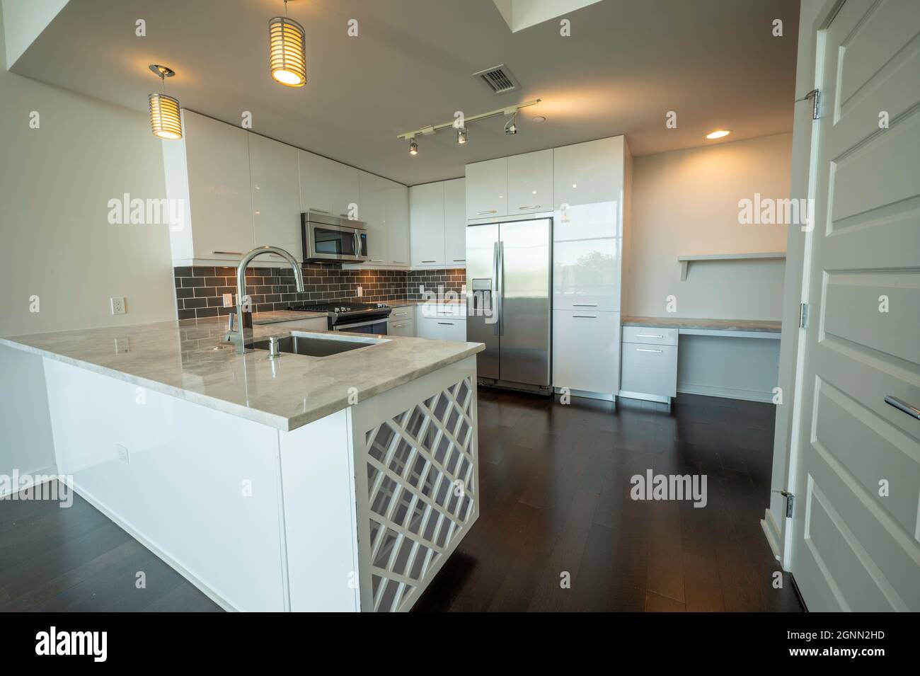 Modern kitchen interior with wine rack and stainless steel appliances