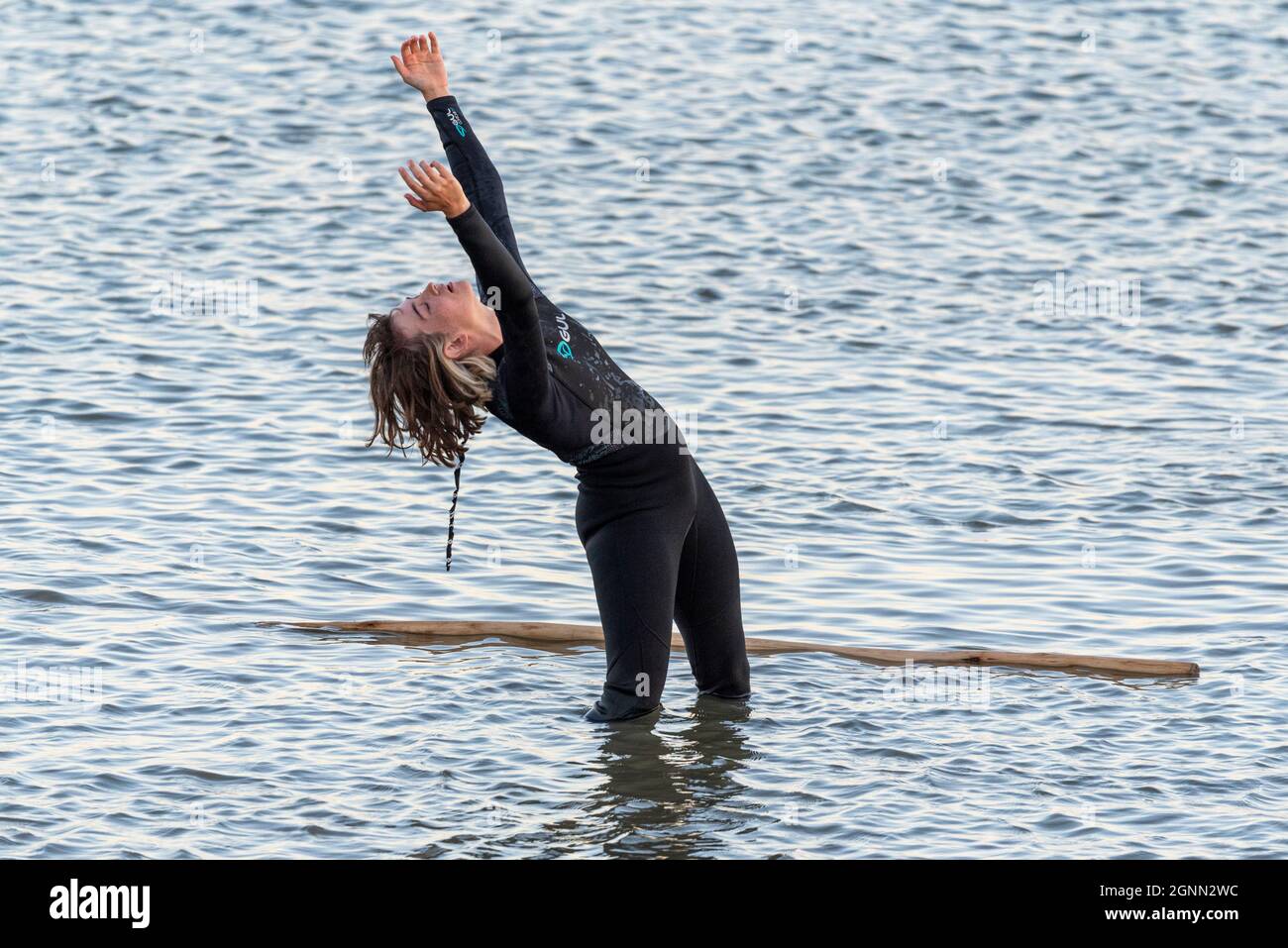 Artistic performance in the Thames Estuary by the Arbonauts at dusk to illustrate the climate emergency, titled SILT, for Estuary Festival 2021. Sea Stock Photo