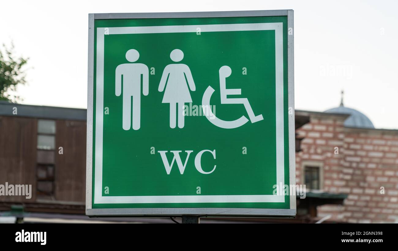 Public toilet sign of restroom with wc sign for men women accessible disabled person in city. Sign and symbol concept photo. Stock Photo