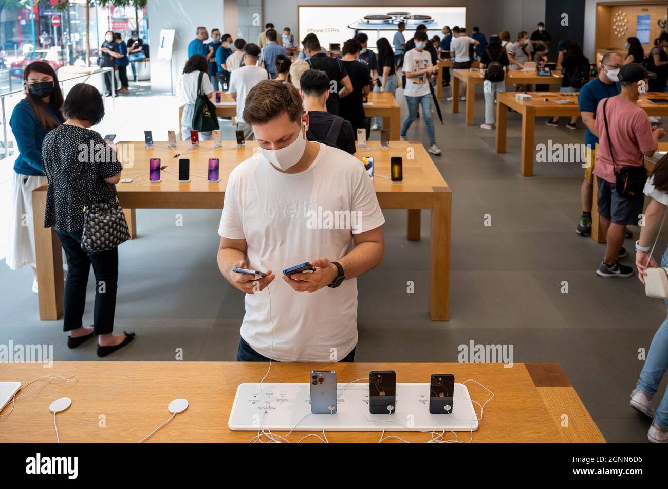 Hong Kong, China. 24th Sep, 2021. Shoppers are testing Apple brand products at an Apple store on the first weekend after the launch of the new iPhone 13 series smartphones in Hong Kong. (Credit Image: © Budrul Chukrut/SOPA Images via ZUMA Press Wire) Stock Photo