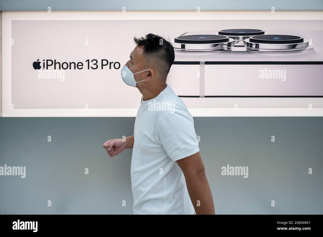 Hong Kong, China. 24th Sep, 2021. A man walks past the Apple store during on the first weekend after the launch of the new iPhone 13 series smartphones in Hong Kong. (Credit Image: © Budrul Chukrut/SOPA Images via ZUMA Press Wire) Stock Photo