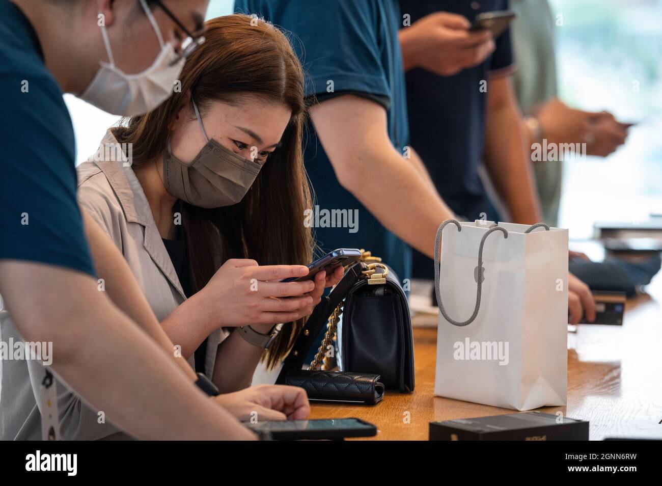 Hong Kong, China. 24th Sep, 2021. Shoppers are seen purchasing Apple brand products at an Apple store on the first weekend after the launch of the new iPhone 13 series smartphones in Hong Kong. (Credit Image: © Budrul Chukrut/SOPA Images via ZUMA Press Wire) Stock Photo