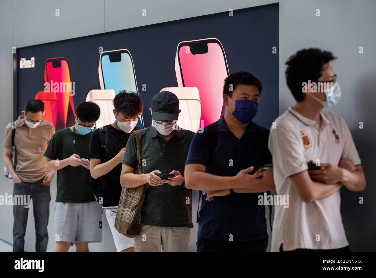 Hong Kong, China. 24th Sep, 2021. Shoppers stand in a queue at an Apple store on the first weekend after the launch of the new iPhone 13 series smartphones in Hong Kong. (Credit Image: © Budrul Chukrut/SOPA Images via ZUMA Press Wire) Stock Photo