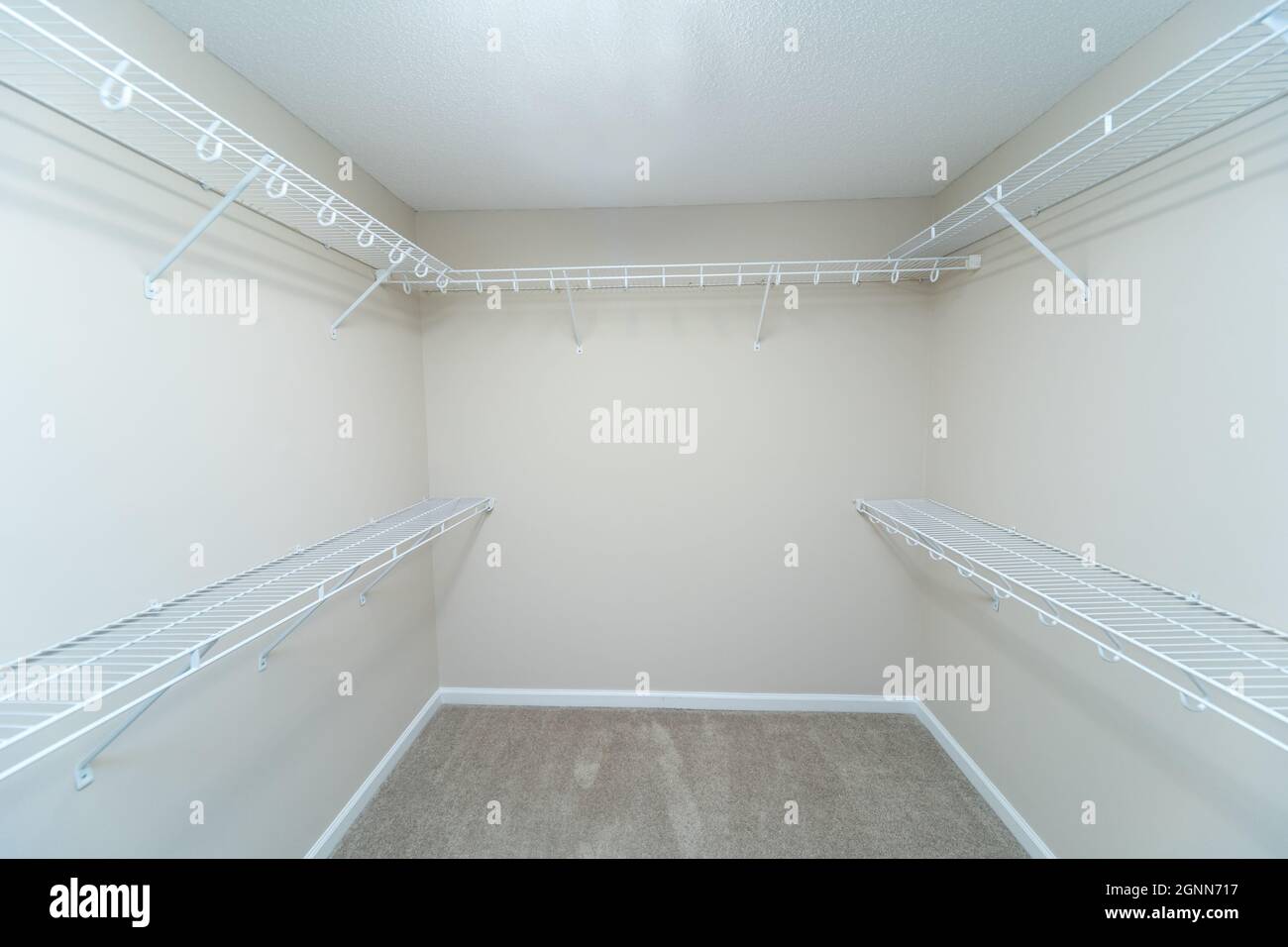 Empty wire shelving storage in an empty closet Stock Photo