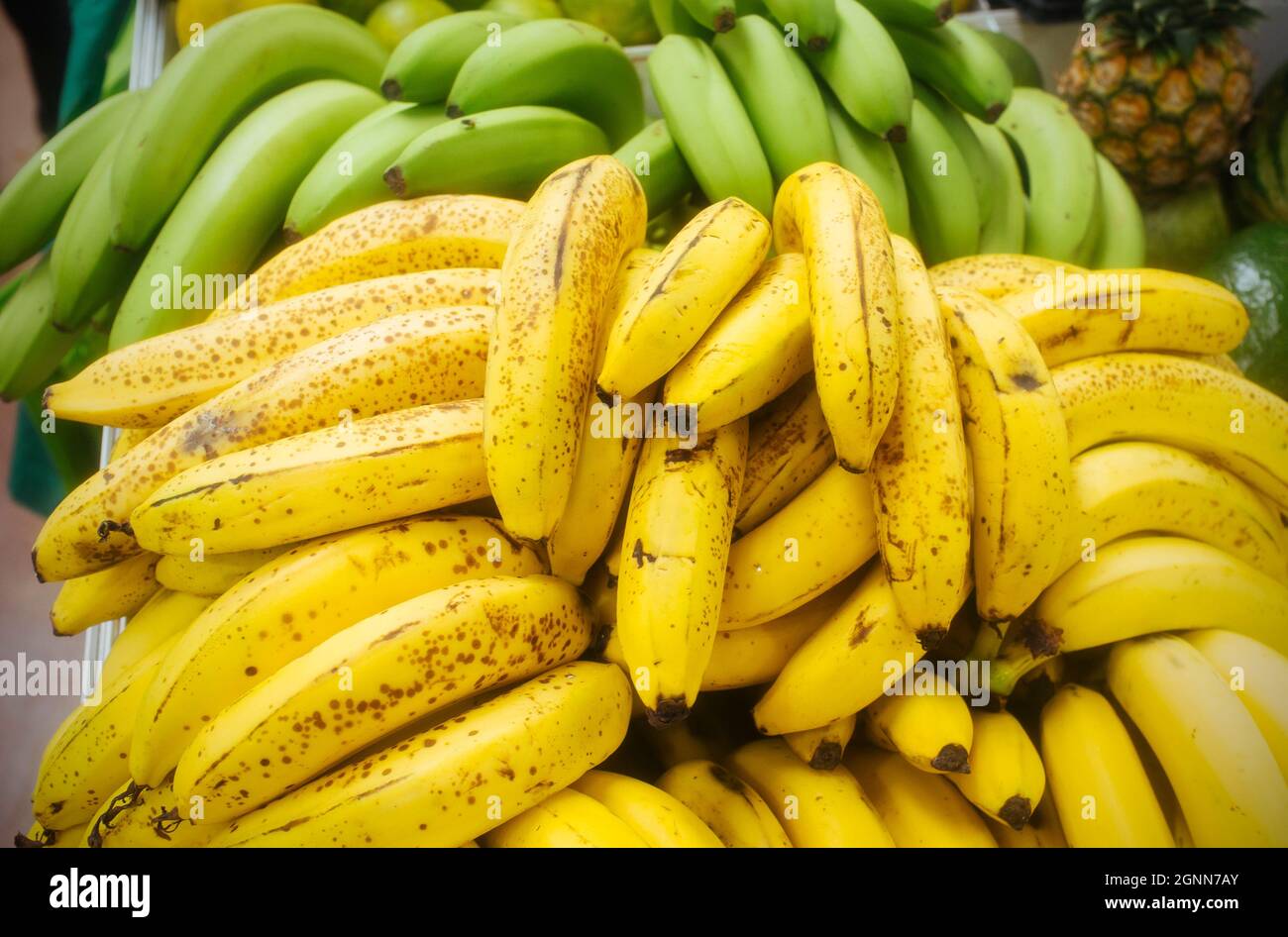 sale of bananas in fruit and vegetable market, display of bananas in public market counter Stock Photo
