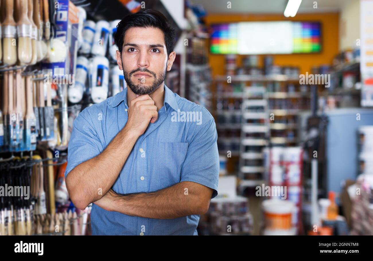 Focused young man paints hi-res stock photography and images - Alamy