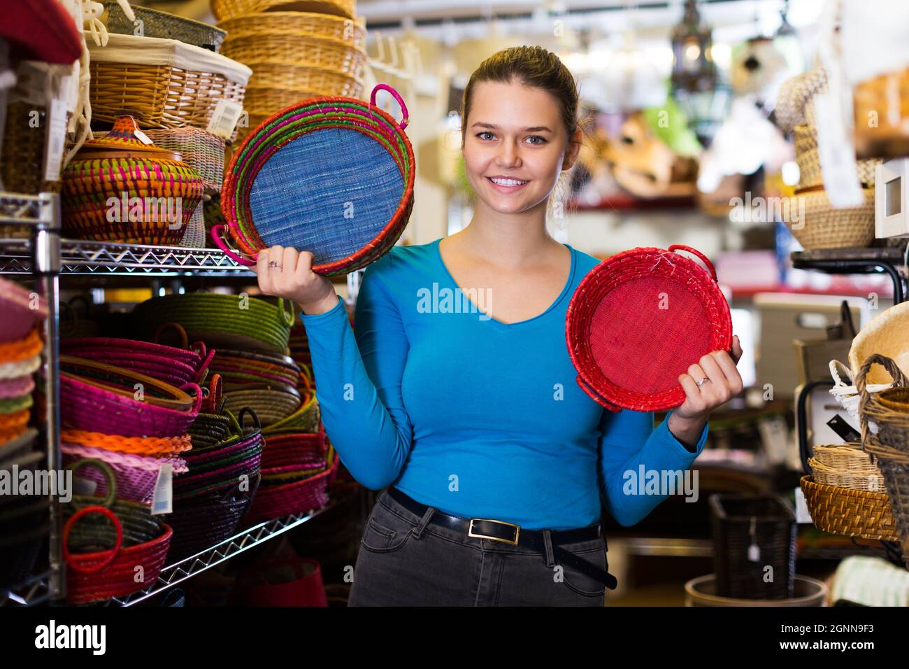 Female teen choosing colour wicker basket Stock Photo Alamy