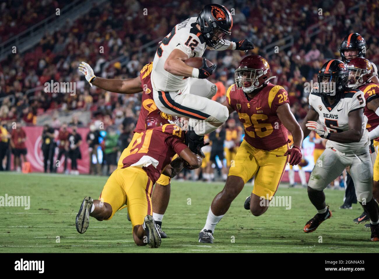 Oregon State Beavers linebacker Jack Colletto (12) is tackled by Southern California Trojans safety Isaiah Pola-Mao (21) during a NCAA football game, Stock Photo