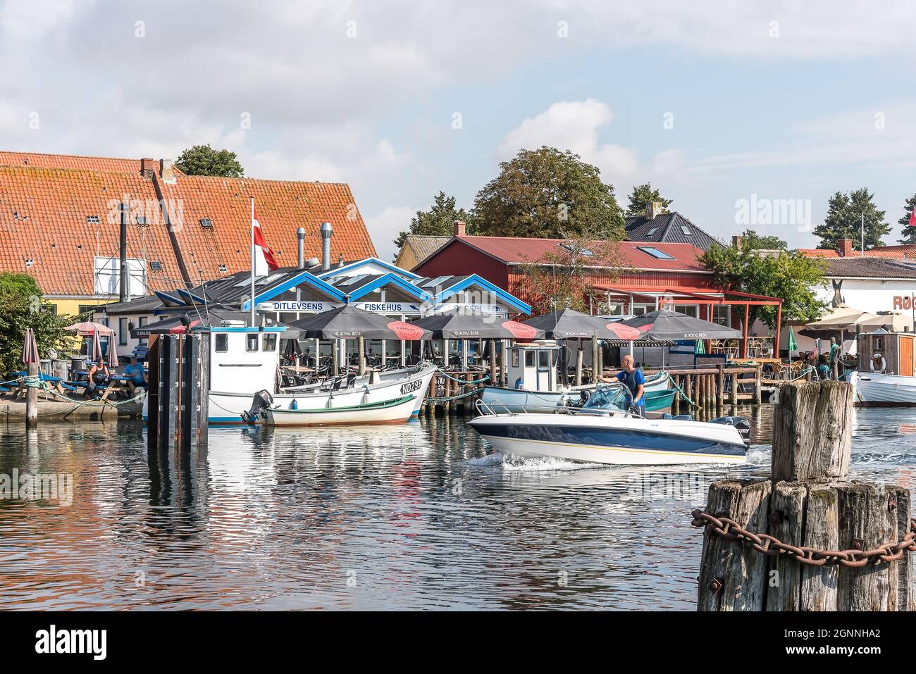 motorboat driving through the idyllic fishing village Karrebæksminde, Denmark, August 7, 2021 Stock Photo